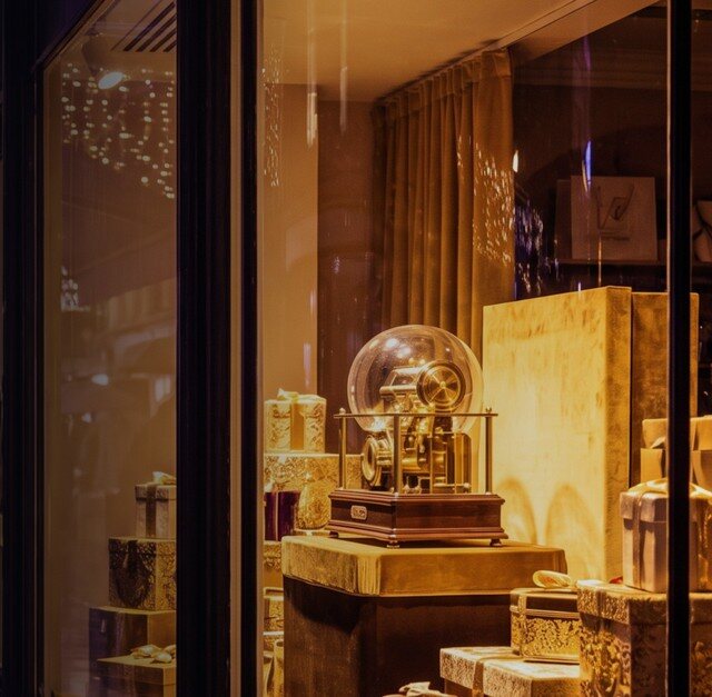A shop window dressed for Christmas at night