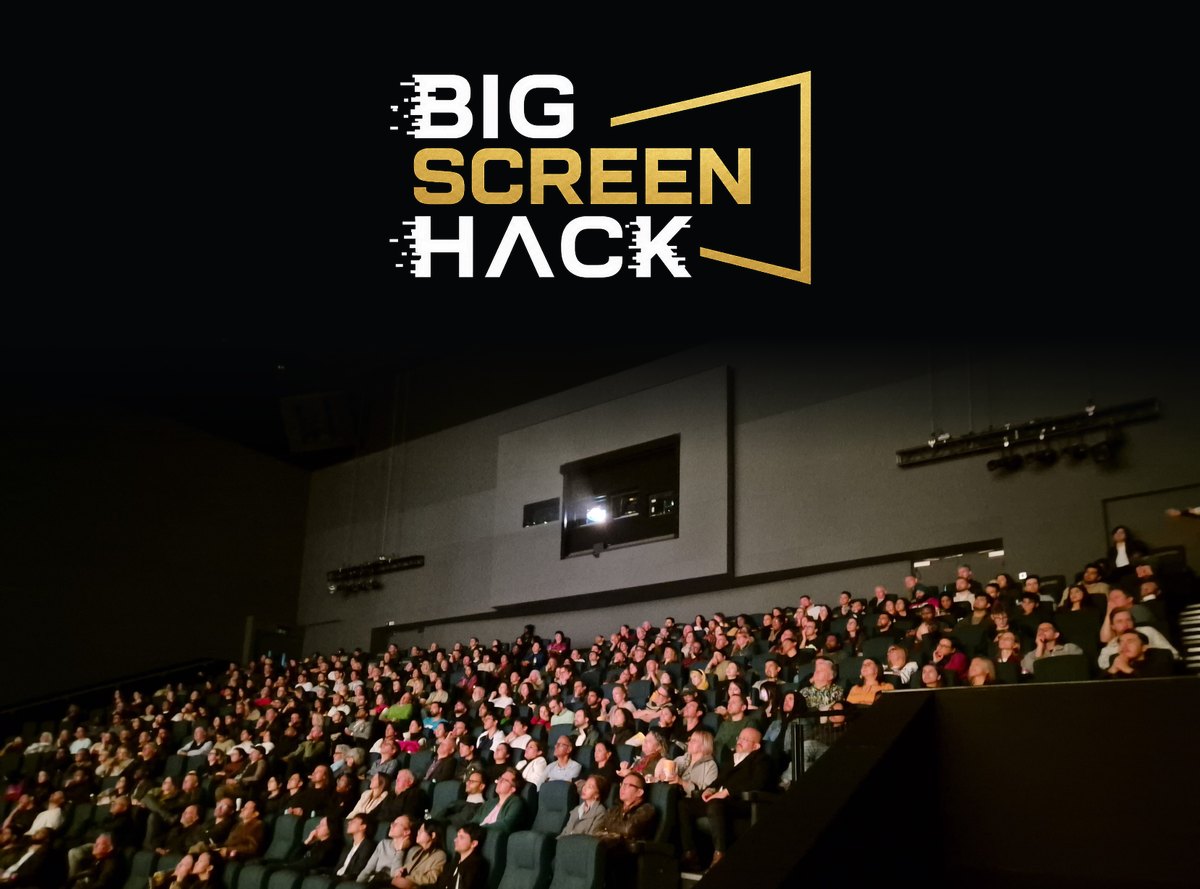 Big Screen Hack above a packed IMAX audience